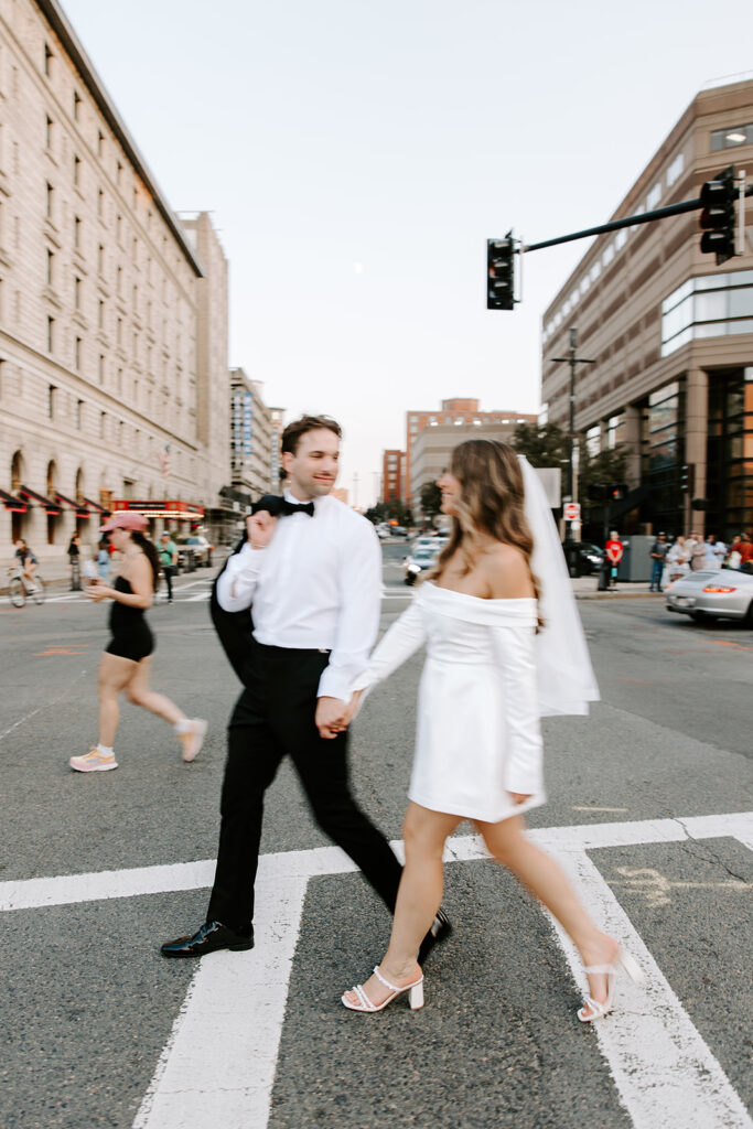Romantic photo of couple strolling through Copley Square at sunset