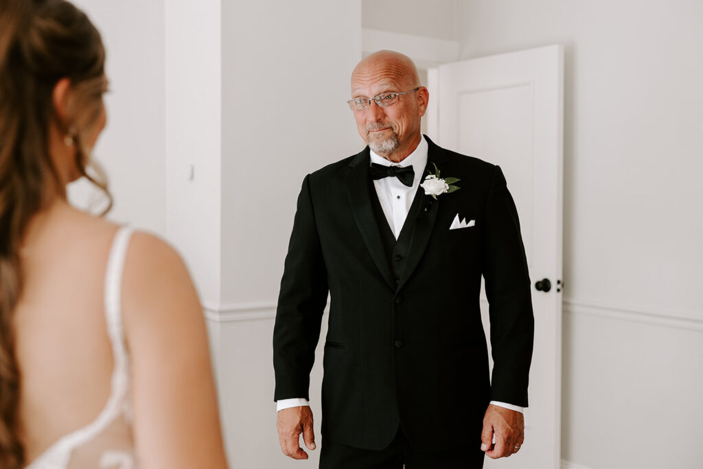 emotional father seeing daughter in wedding dress