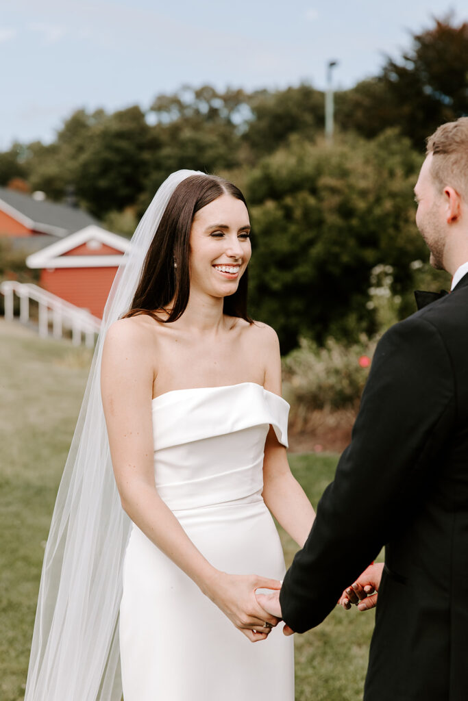 bride smiling during first look