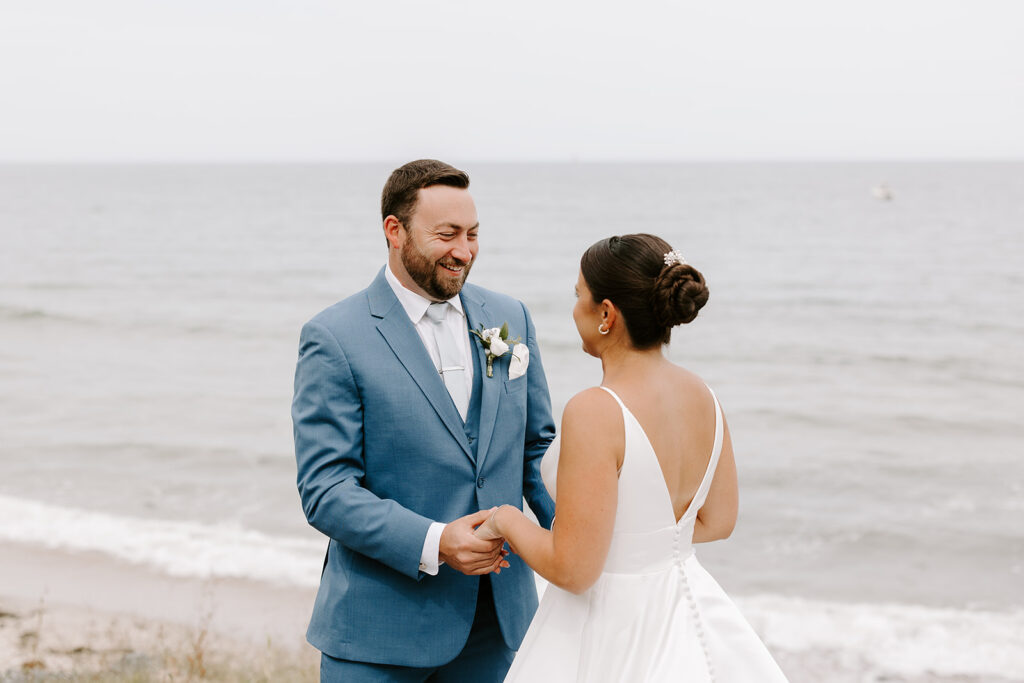 groom beaming as he sees bride for the first time