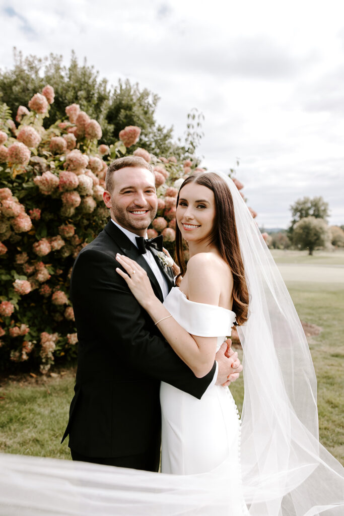 classic bridal portrait with veil flowing in the wind
