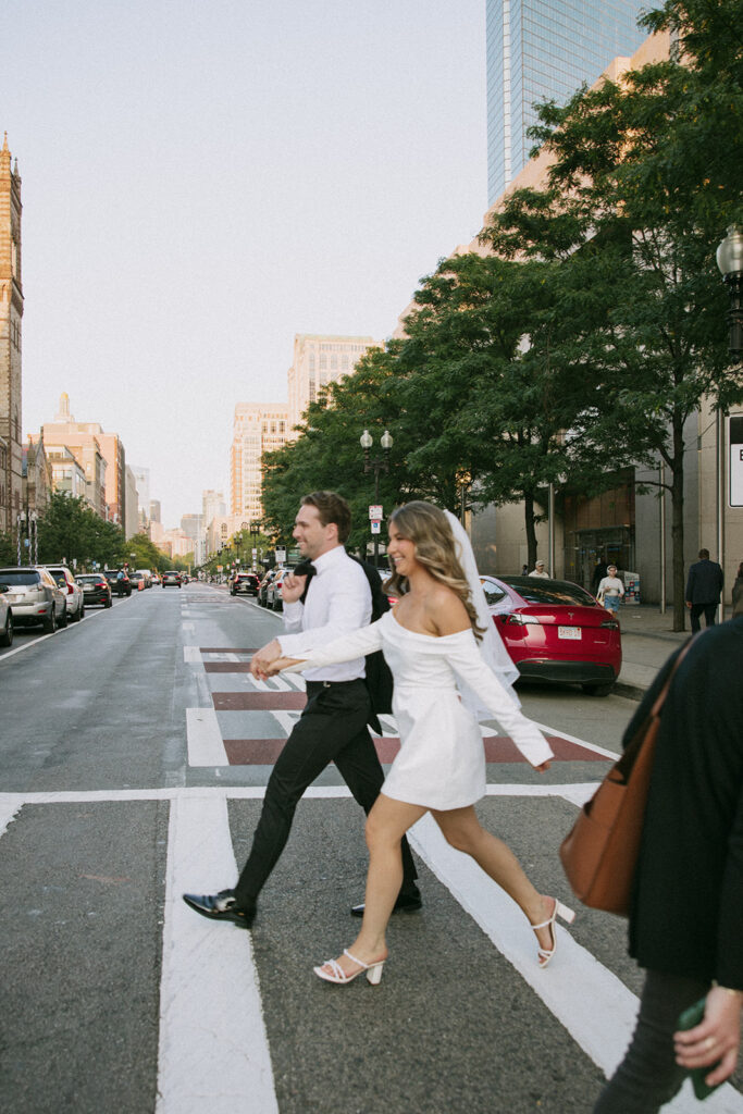 Couple walking hand-in-hand through Back Bay streets