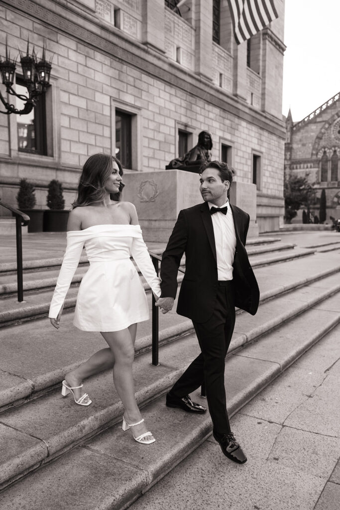 Soft, natural light engagement photo on marble staircase
