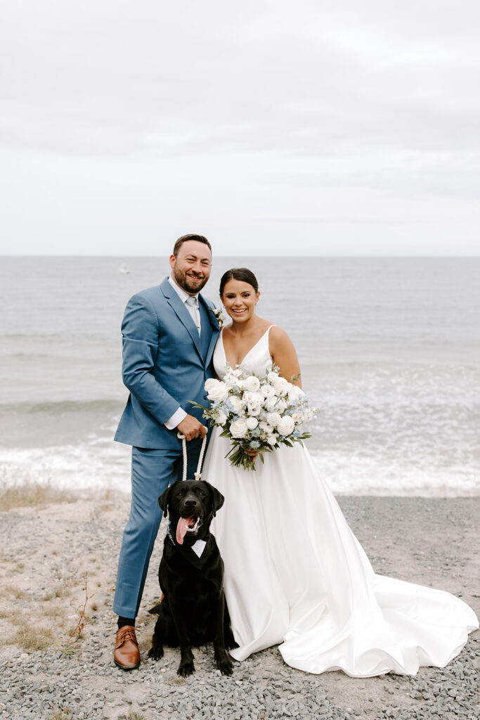 bride and groom and their puppy