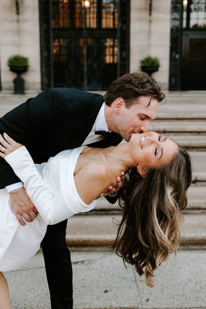 Elegant couple portrait at Boston Public Library main entrance