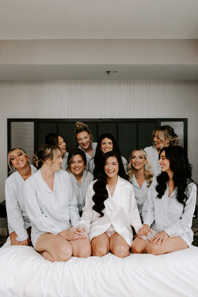 bride and bridesmaids celebrating in pajamas