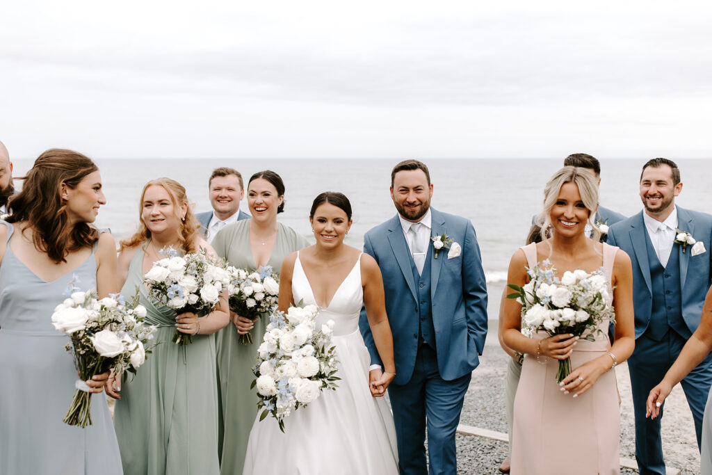 full wedding party in soft pastels