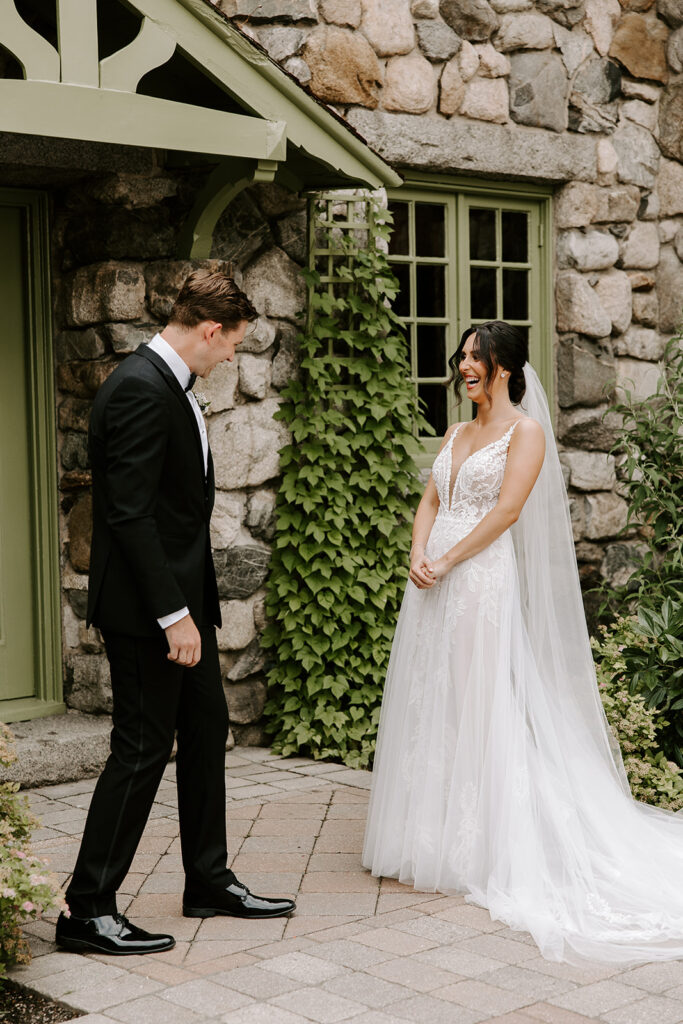 bride laughing during first look