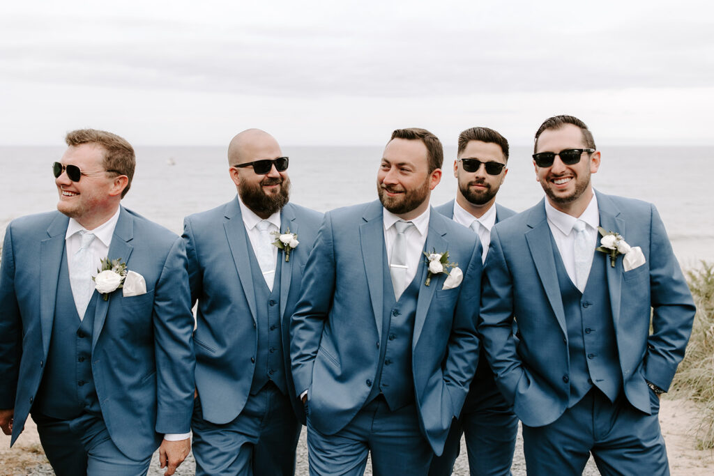 groomsmen walking and laughing together