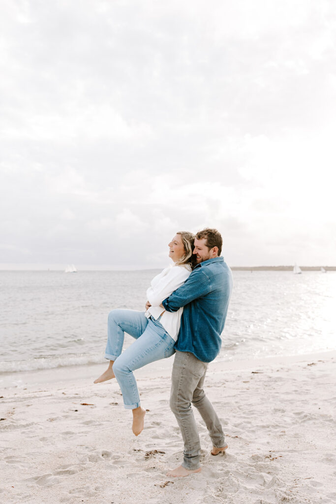 couple playing in the sand joyfully