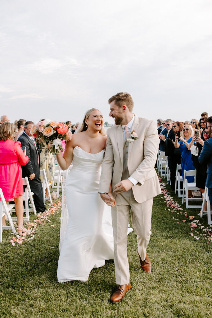 couple walking down aisle