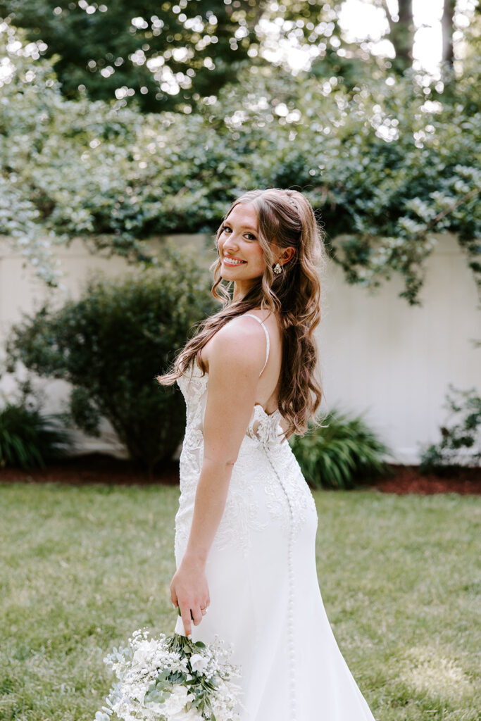 bride posing with bouquet