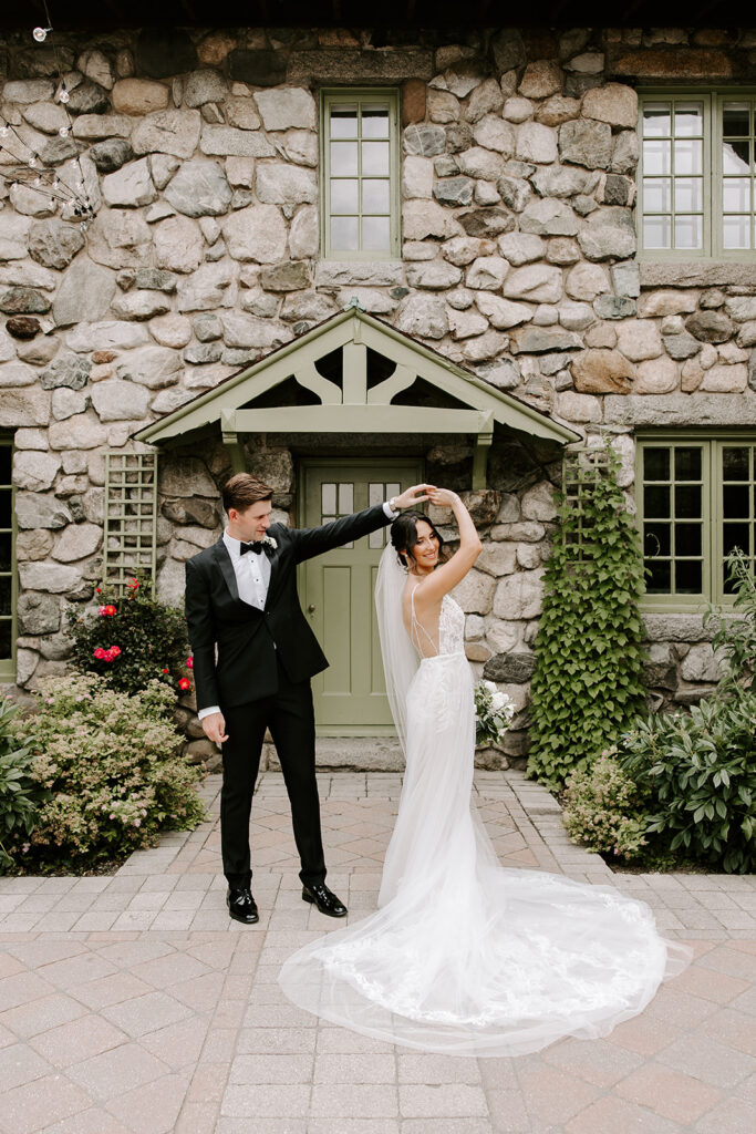 newlyweds dancing in courtyard