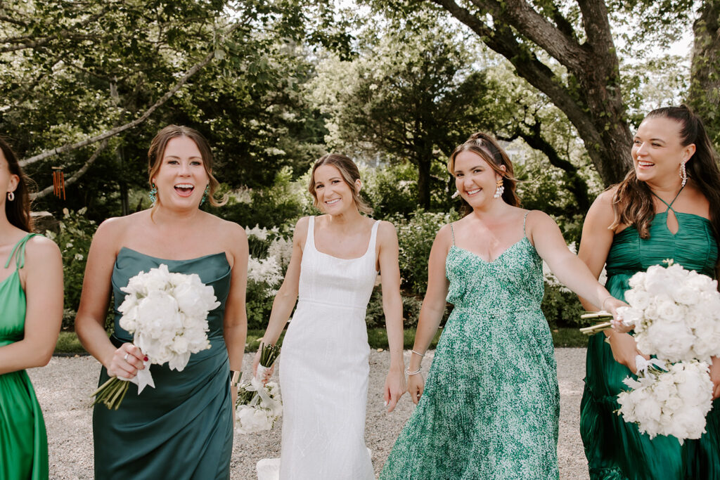 bridesmaids walking and smiling