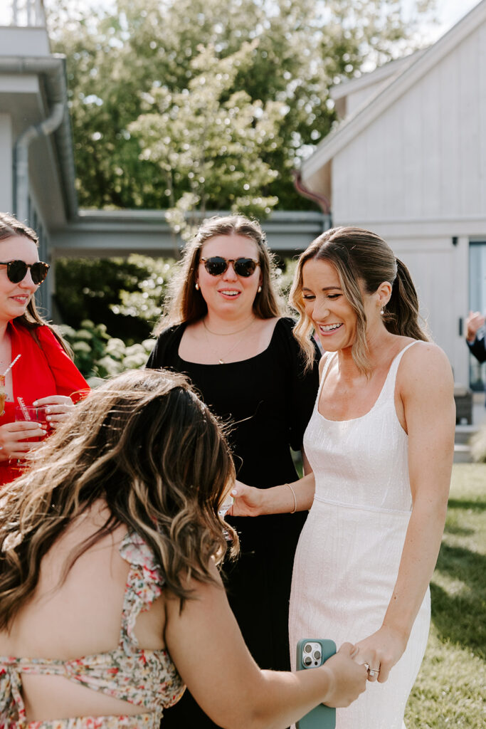 bride greeting guests at cocktail hour