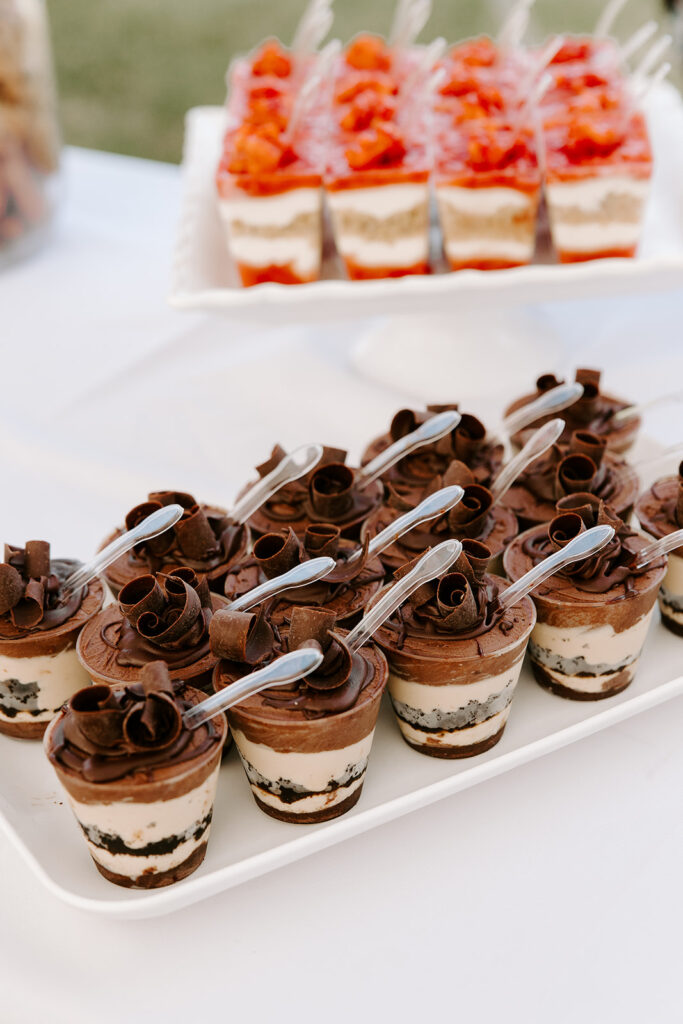 Gourmet dessert spread from Wildflour Bakery, featuring cupcakes, macarons, and pastries.