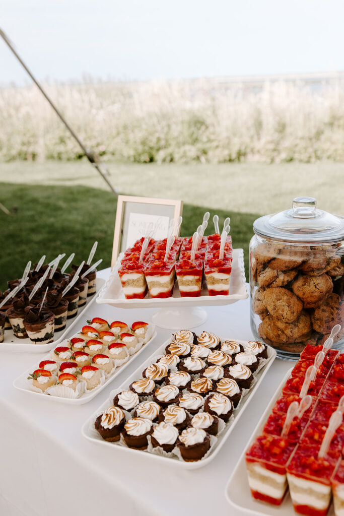 Gourmet dessert spread from Wildflour Bakery, featuring cupcakes, macarons, and pastries.