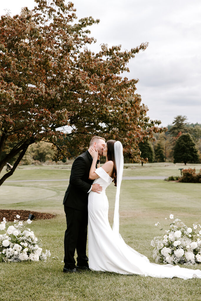 First kiss as newlyweds under the open sky