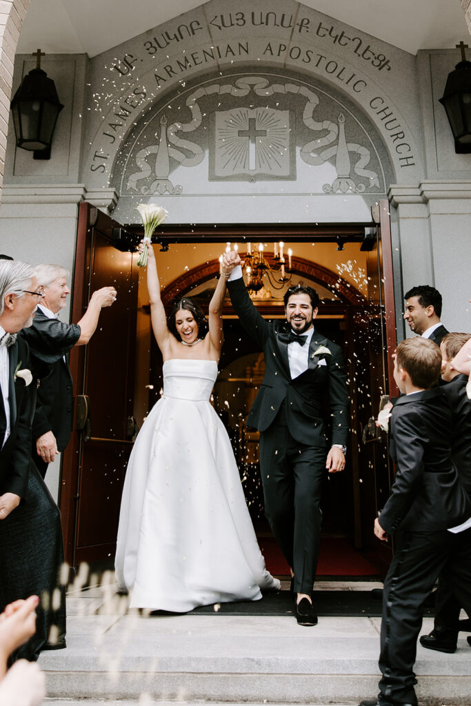 bride and groom overjoyed exiting their wedding ceremony