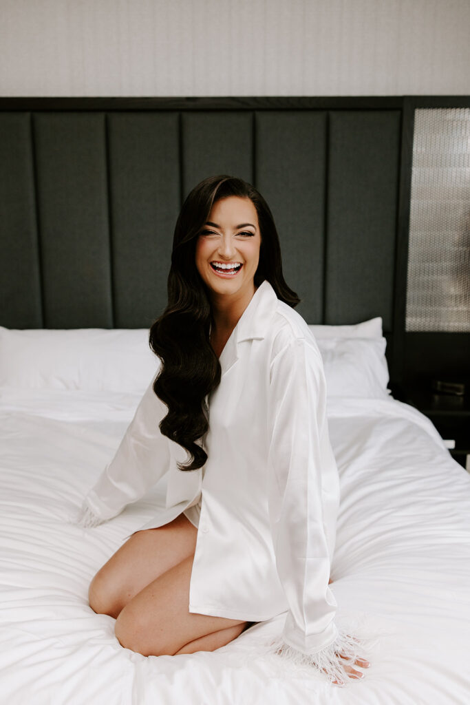 bride smiling in getting ready room