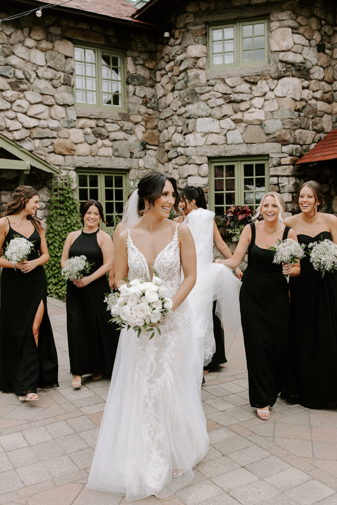 bridesmaids walking through the garden
