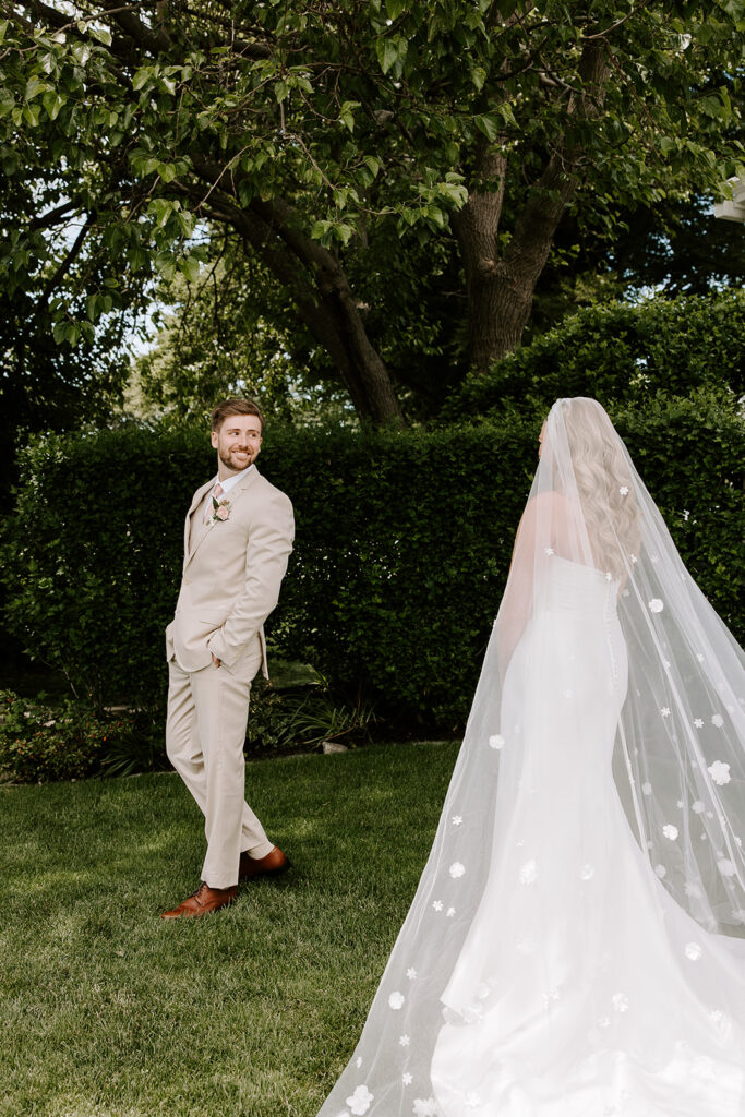 groom turning around first look