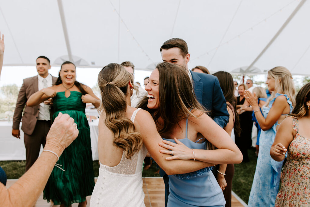 bride dancing with bridesmaids