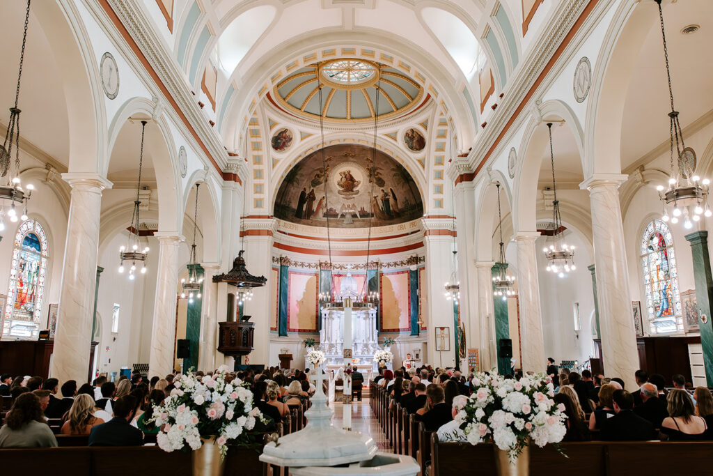 Bride and groom exchanging vows at traditional Catholic wedding ceremony