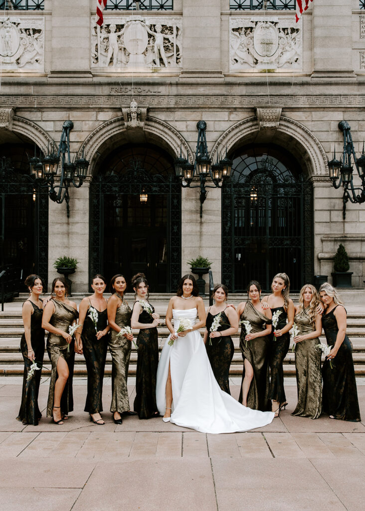 bride and bridesmaids outside of boston public library