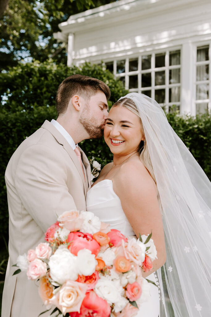 bride and groom with florals
