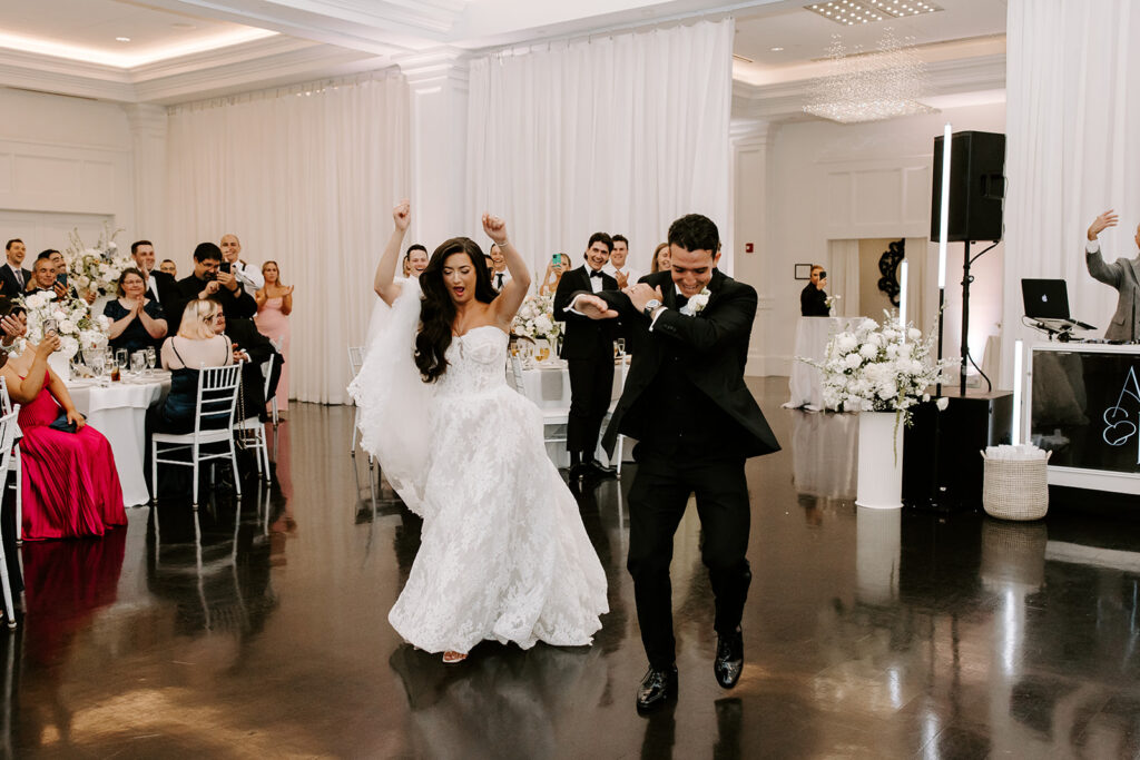 bride and groom entering reception