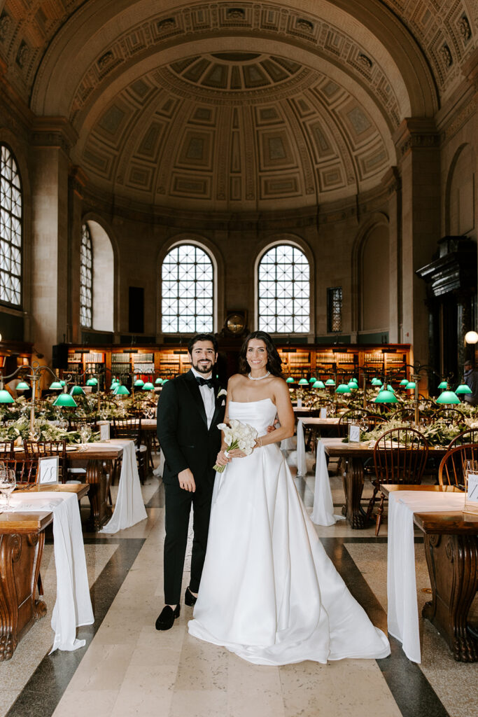 bride and groom posing in boston public library