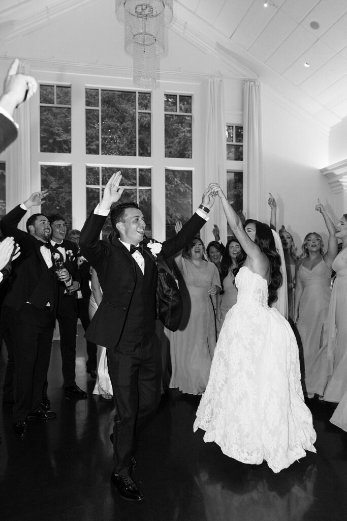 Packed dance floor with guests celebrating