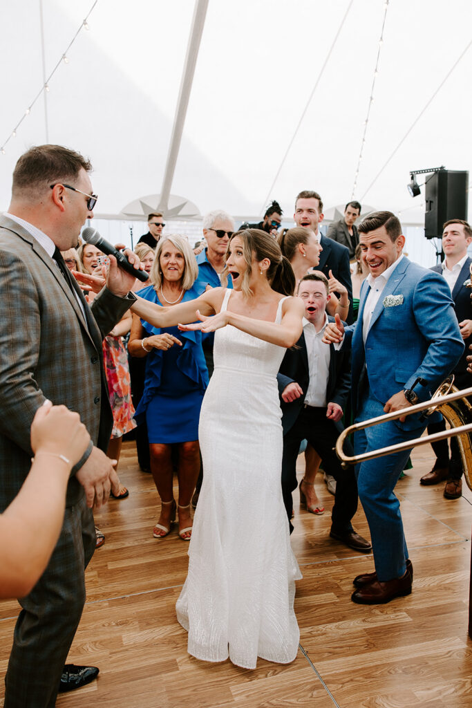 bride and guests dancing to wedding band
