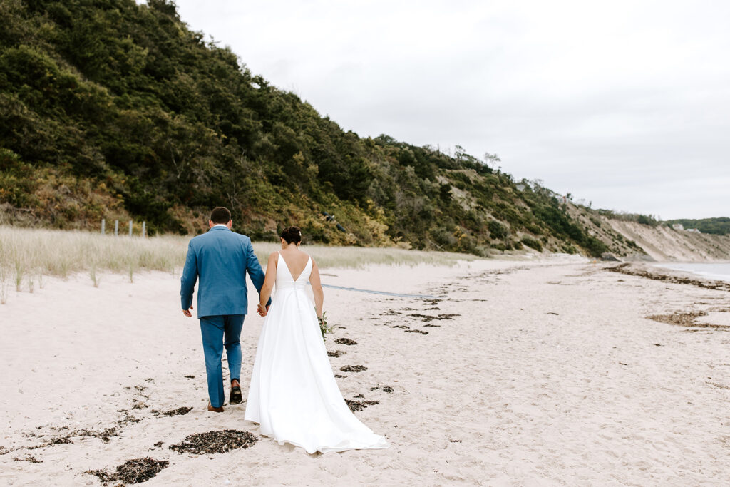 Candid walking photo of couple along the beach