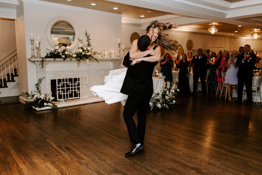 bride and groom entering reception with a spin