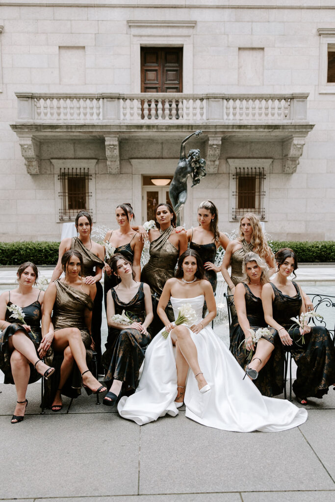 bridesmaids posing in courtyard of boston public librar