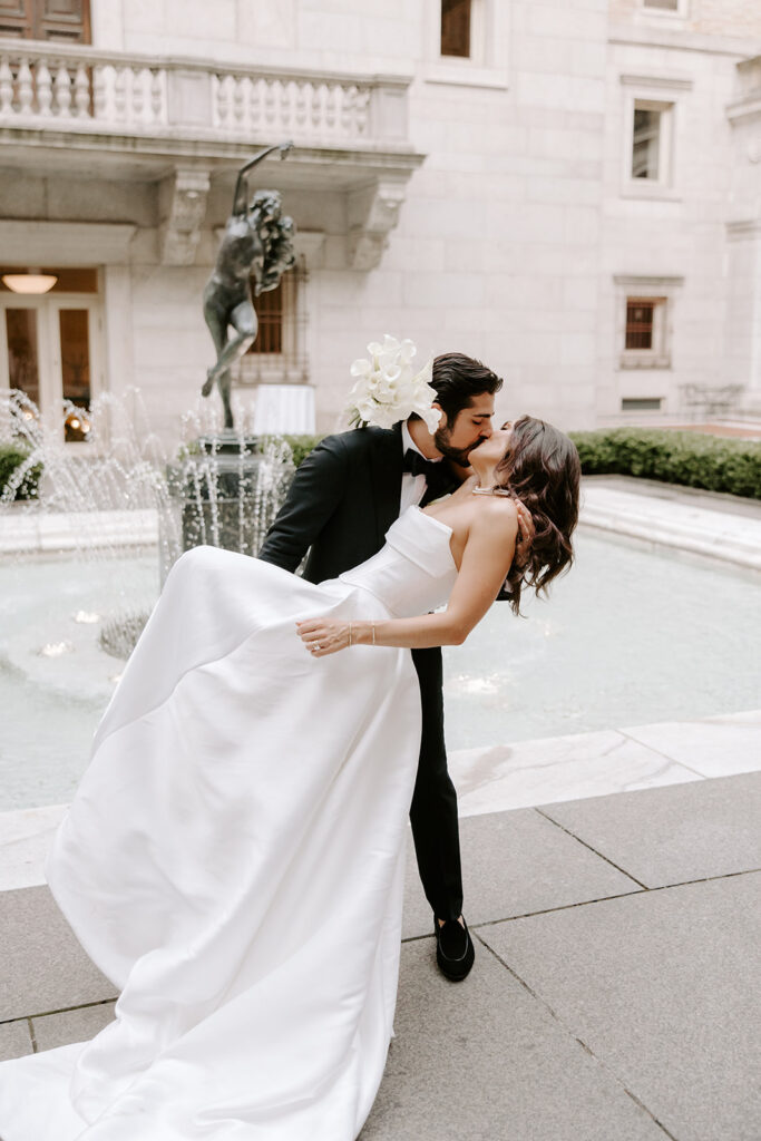 bride and groom dip kiss