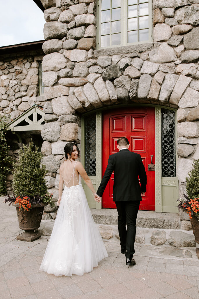 bride and groom walking into willowdale estate