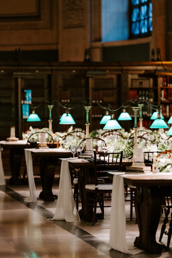 Bride and groom’s sweetheart table at their Boston Public Library wedding reception, designed in black, gold, and ivory