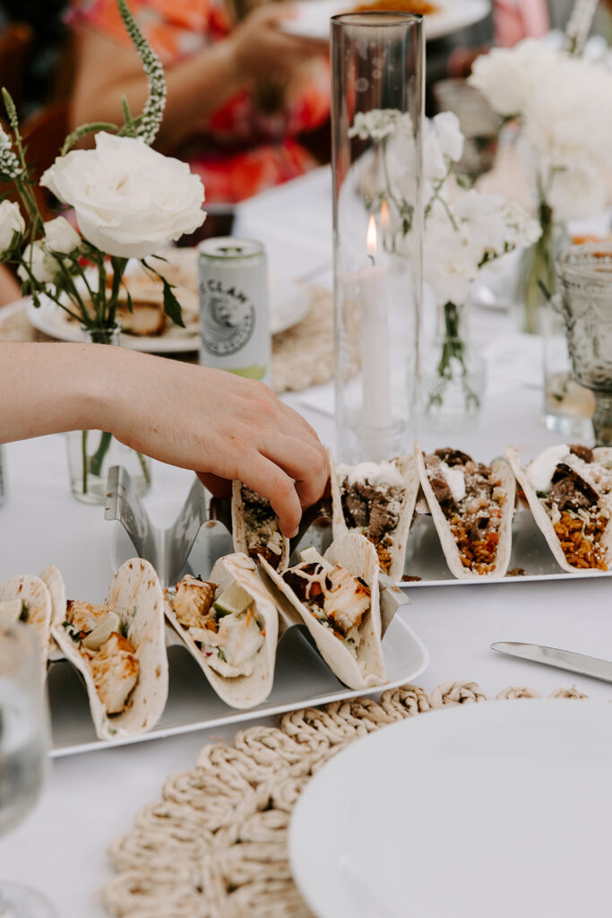Taco bar setup by Chapin’s Catering, featuring fresh tortillas, grilled meats, and colorful toppings