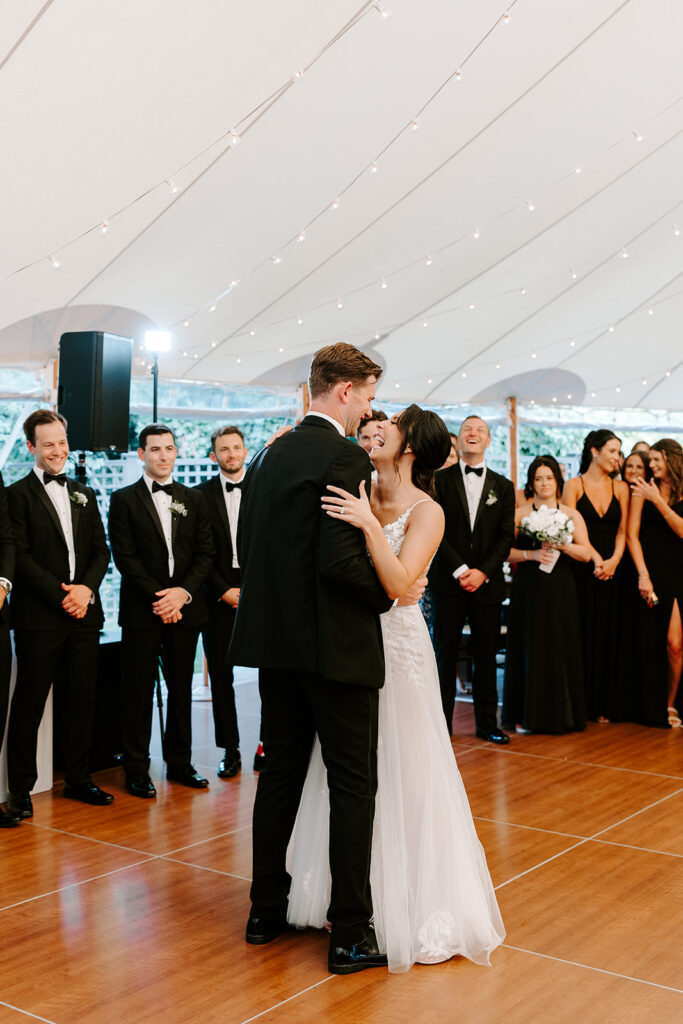 bride and groom staring into eachothers eyes during first dance
