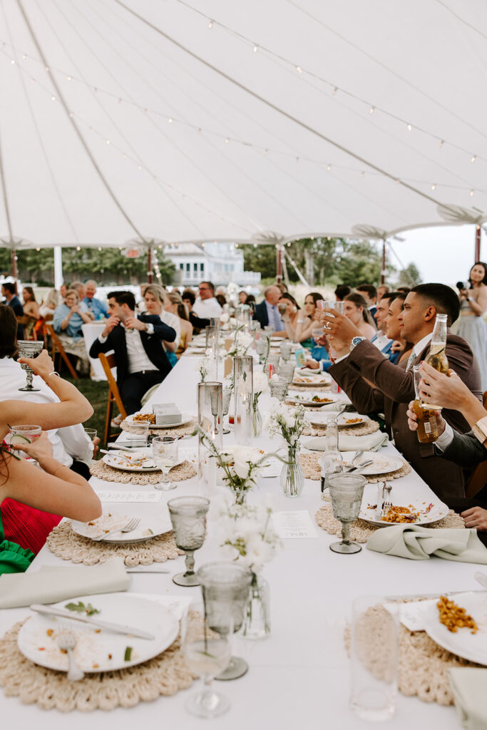 Guests enjoying a casual and delicious taco dinner under the stars at a backyard wedding