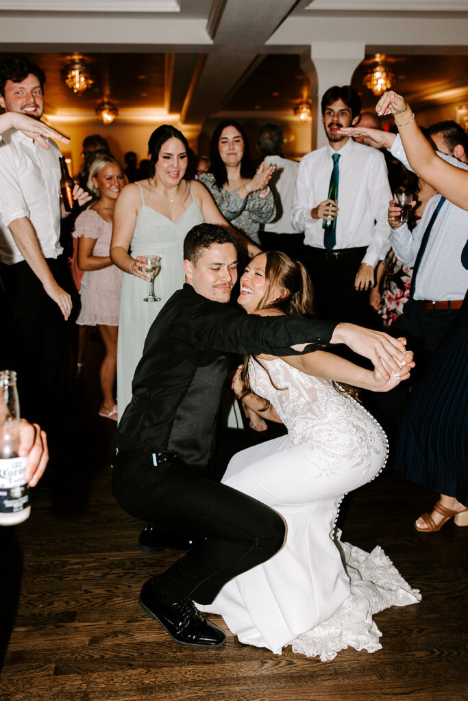bride and groom getting down on the dance floor