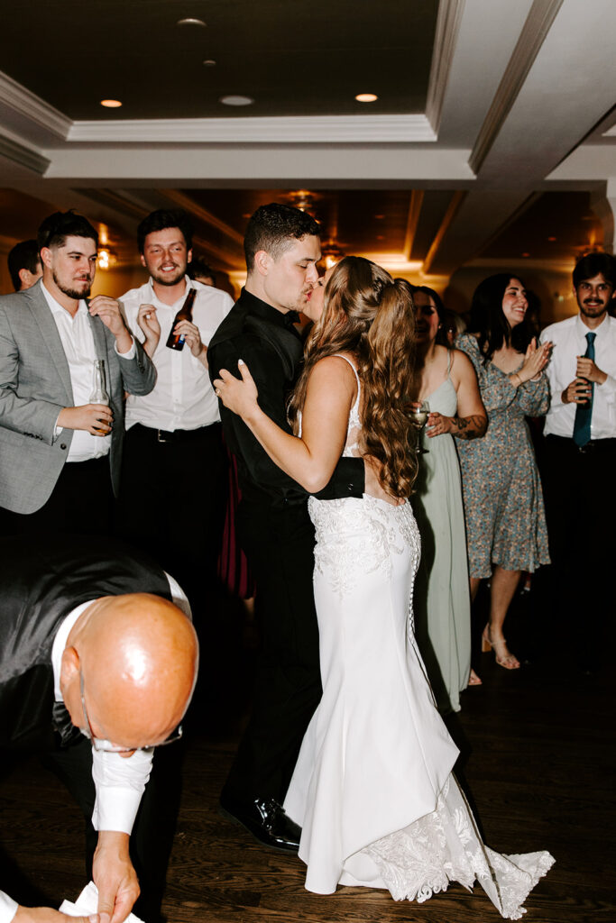 big newlywed kiss on dance floor