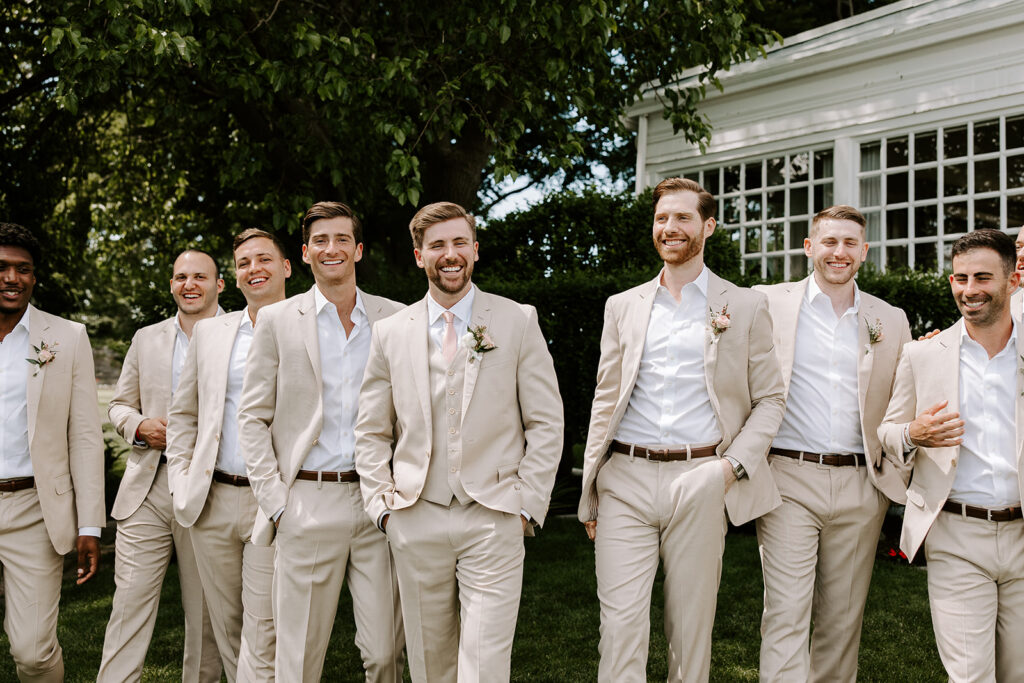 groomsmen walking happily