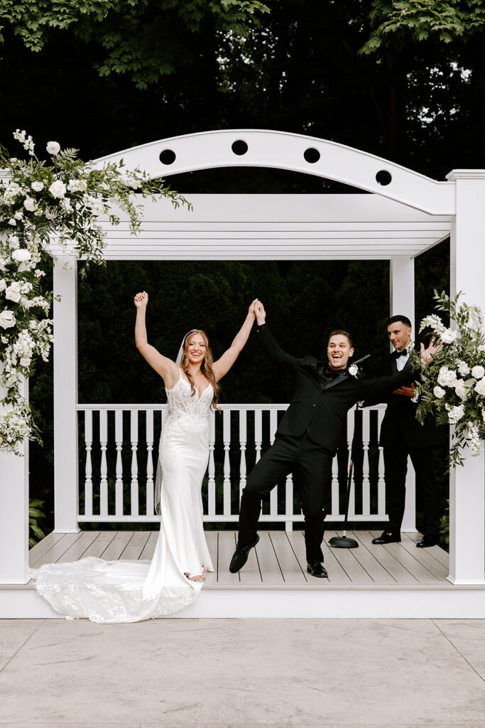 bride and groom celebrating after getting married