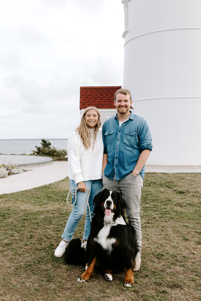 couple posing in front of cape cod lighthouse