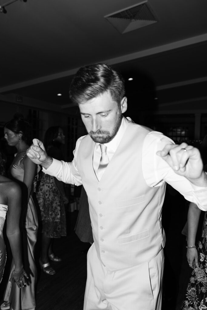 groom dancing reception