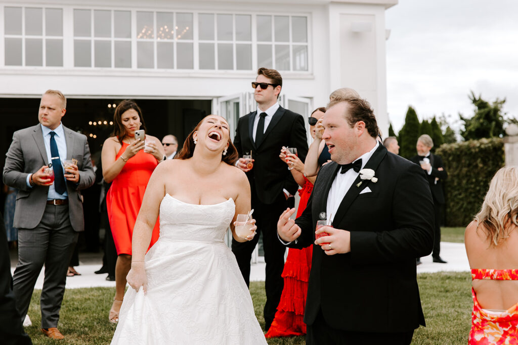 bride laughing on the belle mer lawn